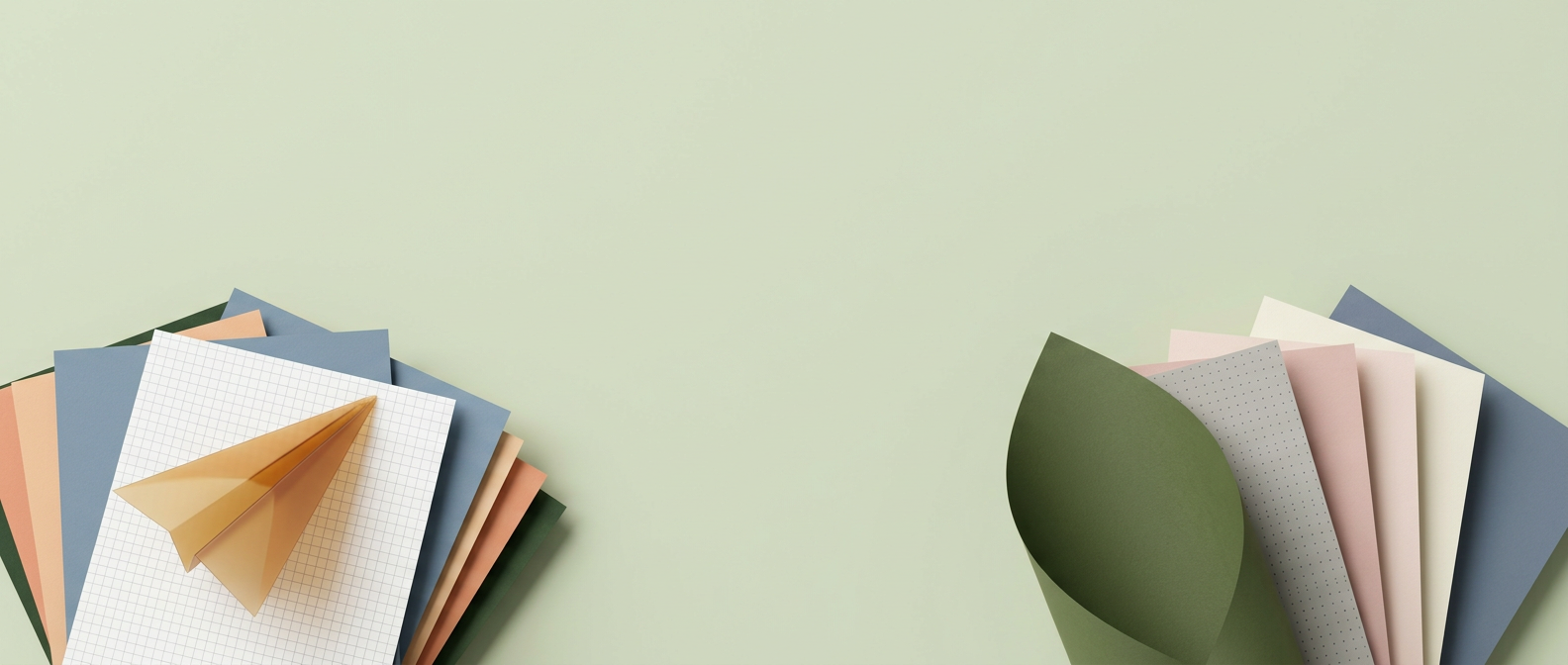 Two fanned clusters of paper sheets in grey graph grid, dusty blue, peach, blush and moss green, with a translucent amber paper plane